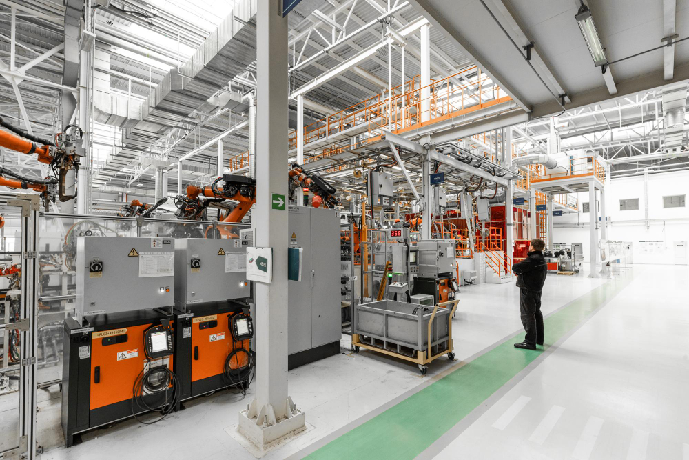 Robotic arms operating on an automotive manufacturing floor